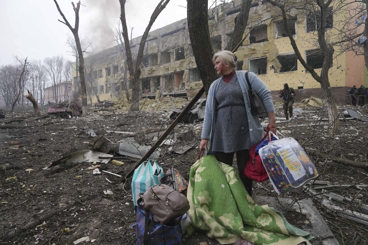 A woman walks outside a maternity hospital that was damaged by shelling in Mariupol, Ukraine. Picture: AP Photo/Evgeniy Maloletka