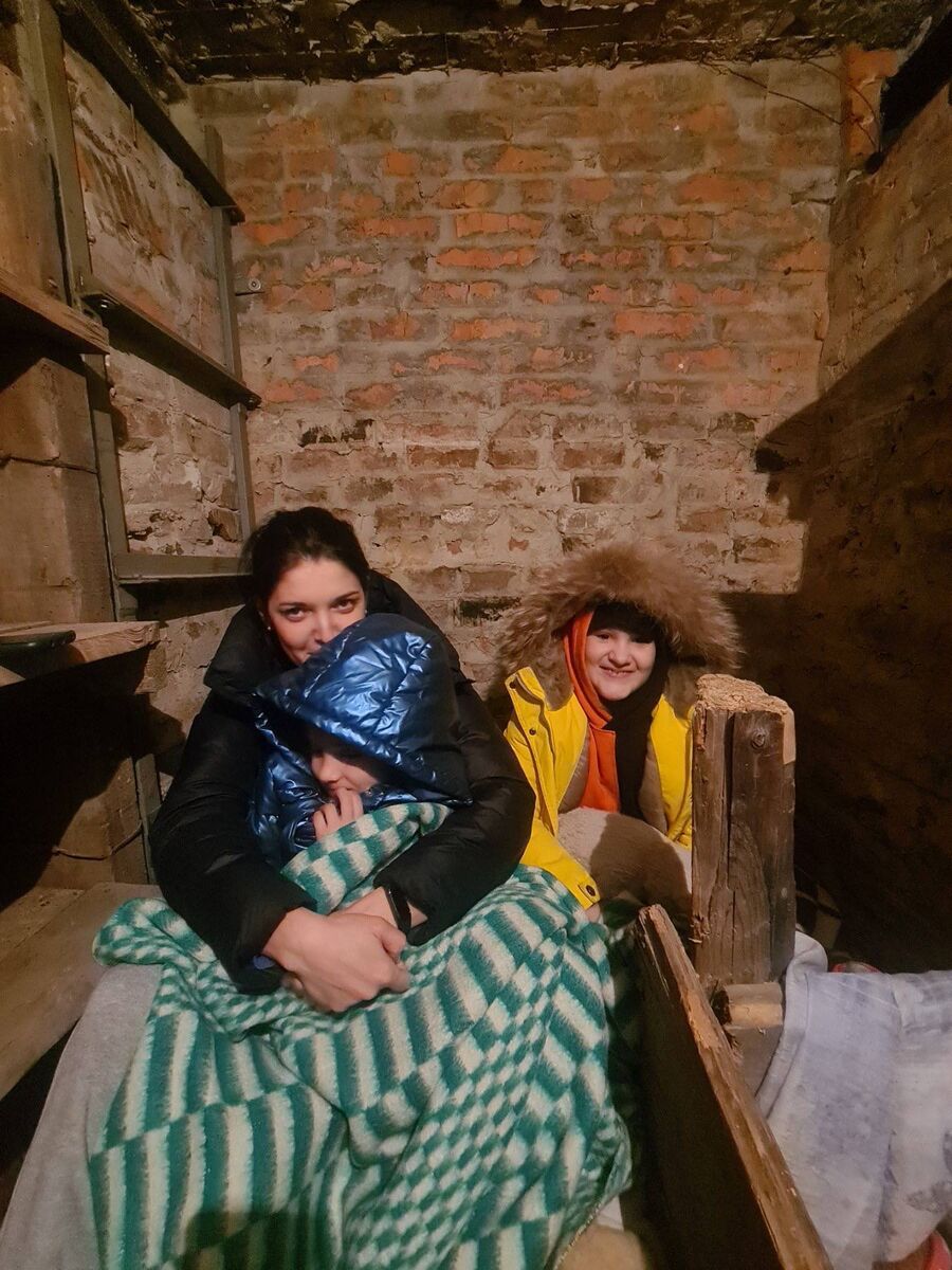 Anya (Nikolai's sister-in-law who is also coming to Ireland) with her daughter Masha and Nikolai's daughter Nika in the bunker before fleeing.