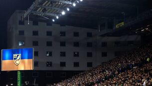 <p>NORWICH, ENGLAND - MARCH 10: The LED screen inside the stadium shows a Ukrainian flag to indicate peace and sympathy with Ukraine during the Premier League match between Norwich City and Chelsea at Carrow Road on March 10, 2022 in Norwich, England. (Photo by Stephen Pond/Getty Images)</p>