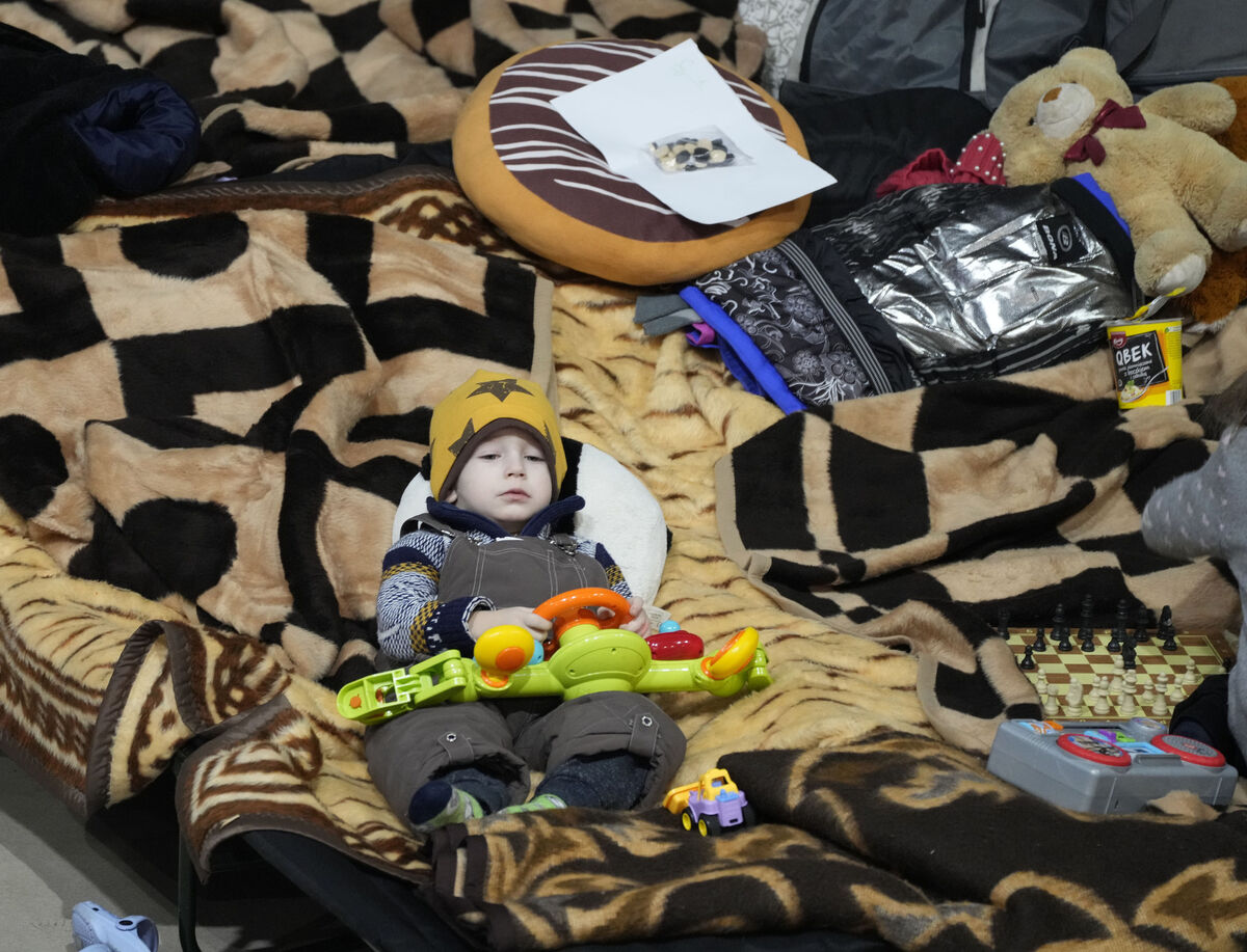 A boy holds a toy as he rests in a centre for Ukrainian refugees in Warsaw, Poland, on Friday. Photo: AP/Czarek Sokolowski A boy holds a toy as he rests in a centre for Ukrainian refugees in Warsaw, Poland, on Friday. Photo: AP/Czarek Sokolowski