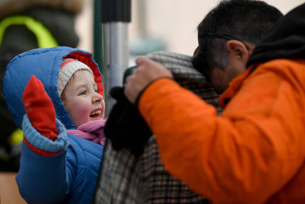 A volunteer plays with Sofia a refugee fleeing the war from neighbouring Ukraine with her family, at the Romanian-Ukrainian border, in Siret, Romania on Friday. Photo: Andreea Alexandru/AP/Shutterstock A volunteer plays with Sofia a refugee fleeing the war from neighbouring Ukraine with her family, at the Romanian-Ukrainian border, in Siret, Romania on Friday. Photo: Andreea Alexandru/AP/Shutterstock
