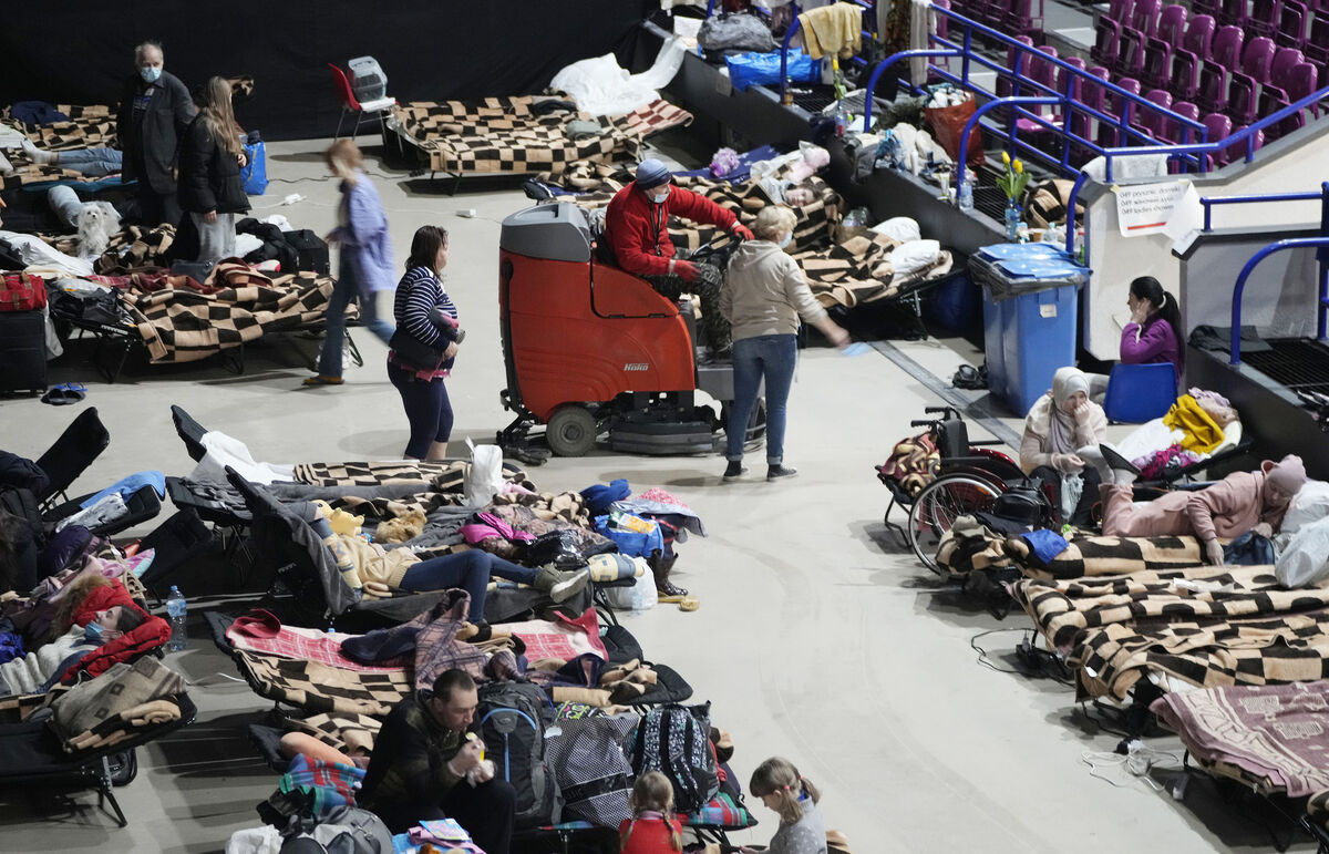 Refugees from the war in Ukraine shelter in a sports centre in Warsaw, Poland, on Friday. Photo: AP/Czarek Sokolowski Refugees from the war in Ukraine shelter in a sports centre in Warsaw, Poland, on Friday. Photo: AP/Czarek Sokolowski