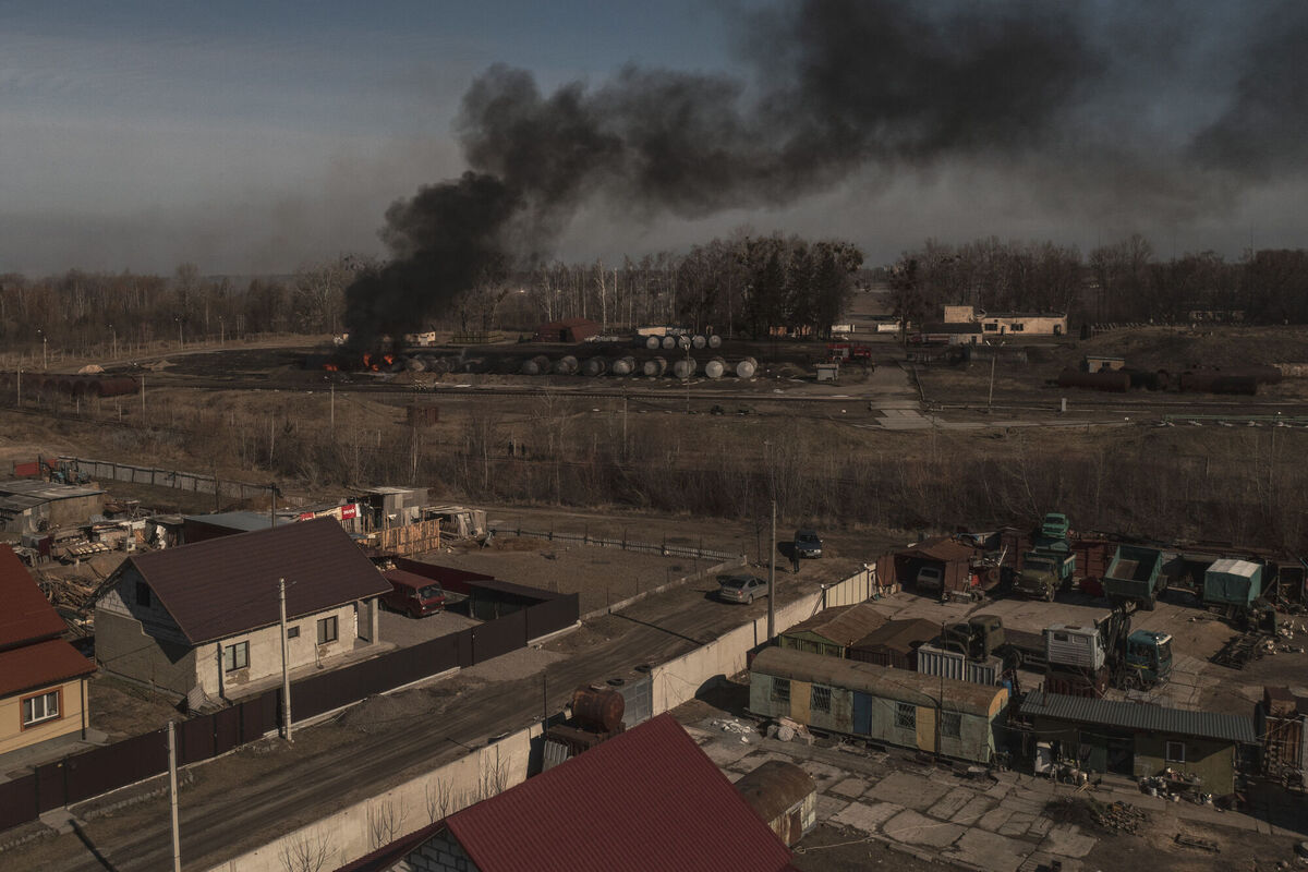 Smoke billows from burning containers after shelling in Vasylkiv, southwest of Kyiv. Picture: AP Photo/Felipe Dana Smoke billows from burning containers after shelling in Vasylkiv, southwest of Kyiv. Picture: AP Photo/Felipe Dana