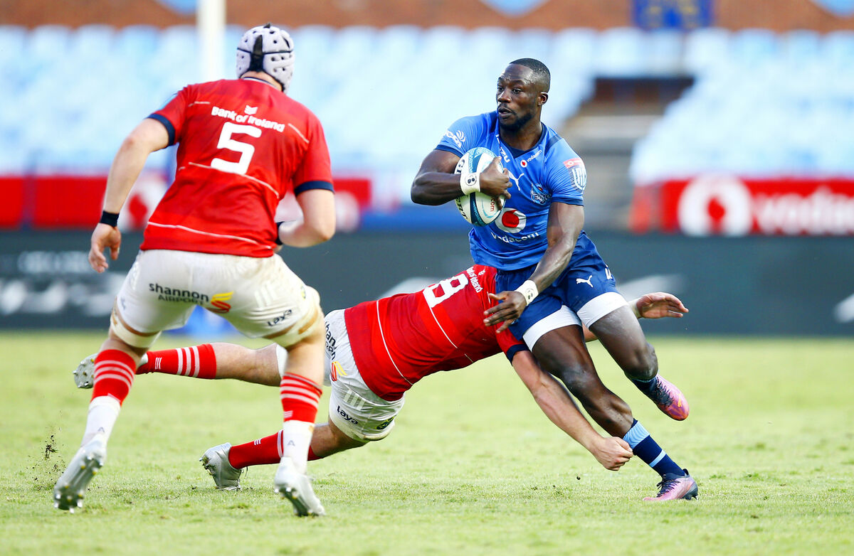 Madosh Tambwe of the Vodacom Bulls tackled by Alex Kendellen of Munster
