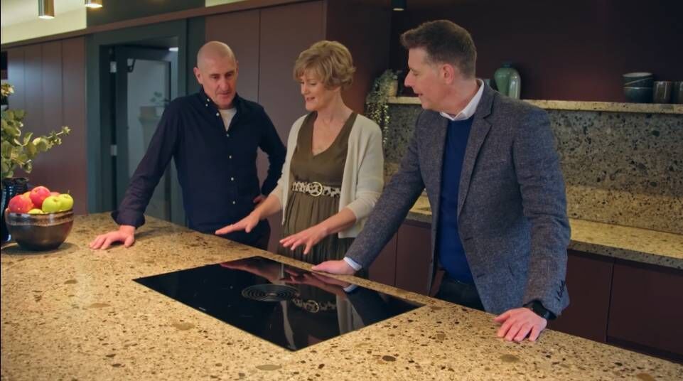 Dermot with the couple in their new kitchen.