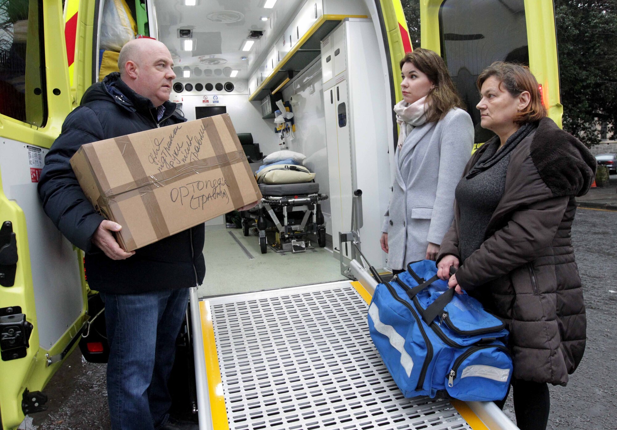 David Hall, CEO Lifeline Abulance Service, with doctors, Kateryna Kachurets, centre, and Nataliya Kononenk, at the Ukrainian Embassy in Dublin loading supplies in support of the ‘Medical Help Ukraine’ campaign. Picture: Mark Stedman