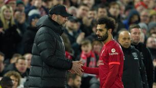 <p>Liverpool's Jurgen Klopp and Mohamed Salah. Klopp says Salah is 'very professional and desperate to play each game'. Picture: Peter Byrne/PA Wire. </p>