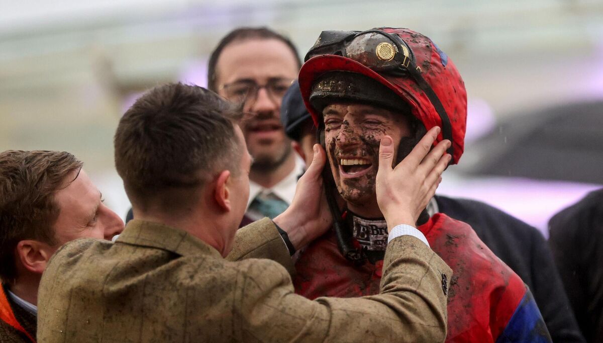 Patrick Mullins celebrates after the champion Bumper with the winning connections