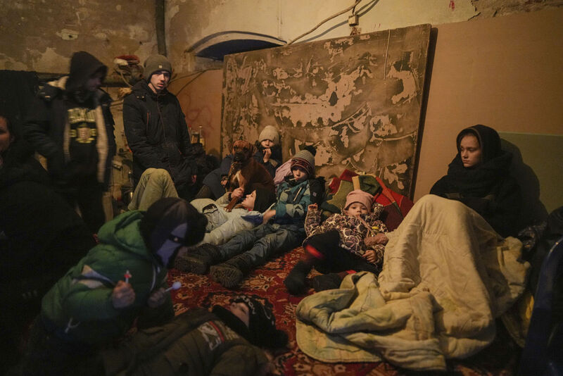 People settle in a bomb shelter in Mariupol, Ukraine, Sunday, March 6, 2022. (AP Photo/Evgeniy Maloletka)