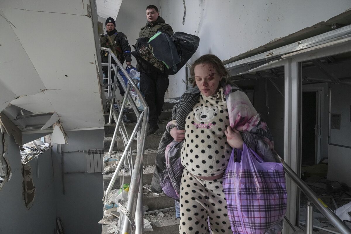 Mariana Vishegirskaya walks downstairs at a maternity hospital damaged by shelling in Mariupol, Ukraine, March 9, 2022. Vishegirskaya survived the shelling and later delivered a baby girl in another hospital. (AP Photo/Evgeniy Maloletka)