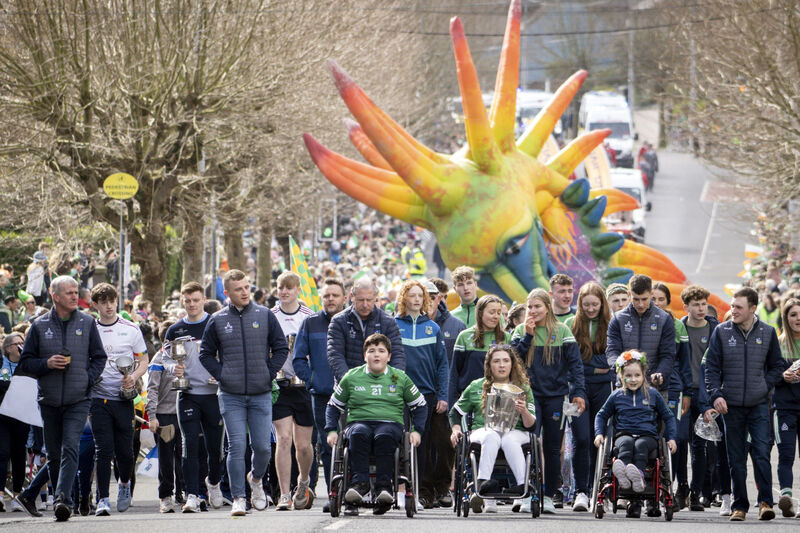 Members of Limerick CLG pictured with the Liam McCarthy Cup as an estimated 50.000 people lined the streets of Limerick for the welcome return of the St Patrick's Day parade. Picture: Don Moloney Members of Limerick CLG pictured with the Liam McCarthy Cup as an estimated 50.000 people lined the streets of Limerick for the welcome return of the St Patrick's Day parade. Picture: Don Moloney