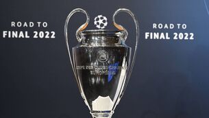 <p>The trophy is displayed ahead of the draw for the 2022 UEFA Champions League quarter-finals, semi-finals and final at the UEFA headquarters, in Nyon, on March 18, 2022. (Photo by Fabrice COFFRINI / AFP) (Photo by FABRICE COFFRINI/AFP via Getty Images)</p>