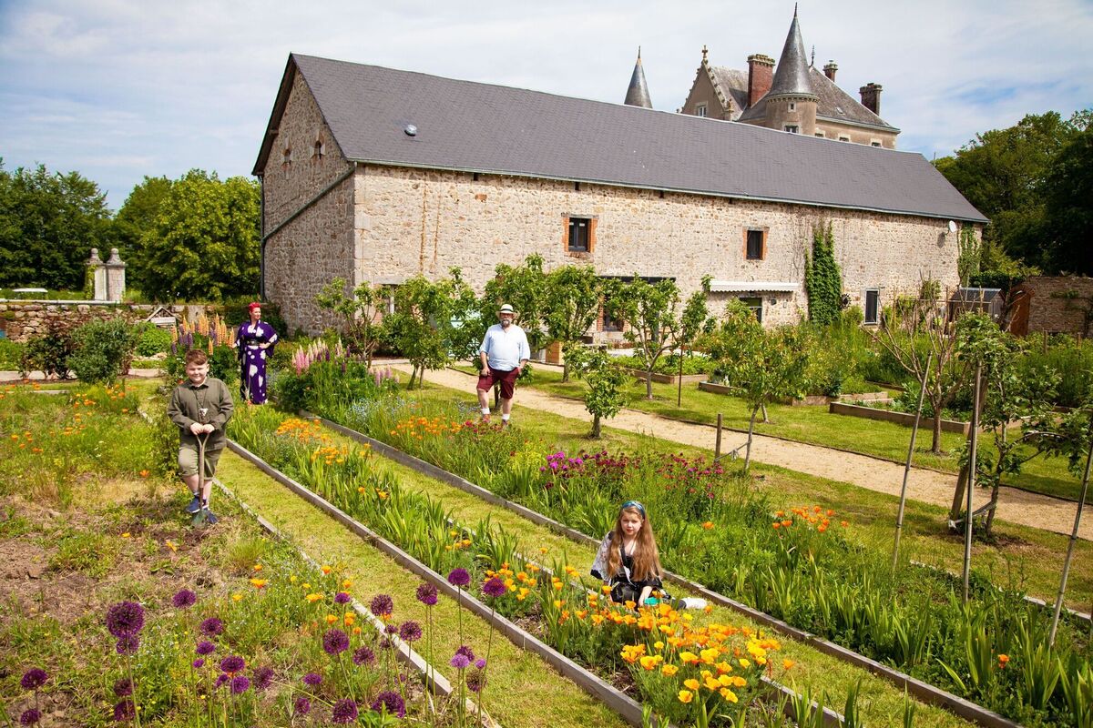  The Strawbridges, including Angel, Dick and children Arthur and Dorothy, in the family garden at their Chateau de la Motte Husson.