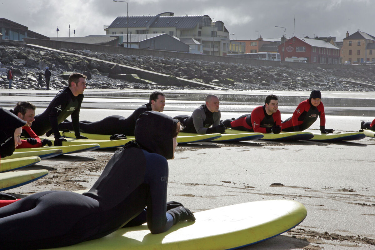 Surfing students braving the elements at Lahinch Surf School. Pic: Don Moloney / Press 22