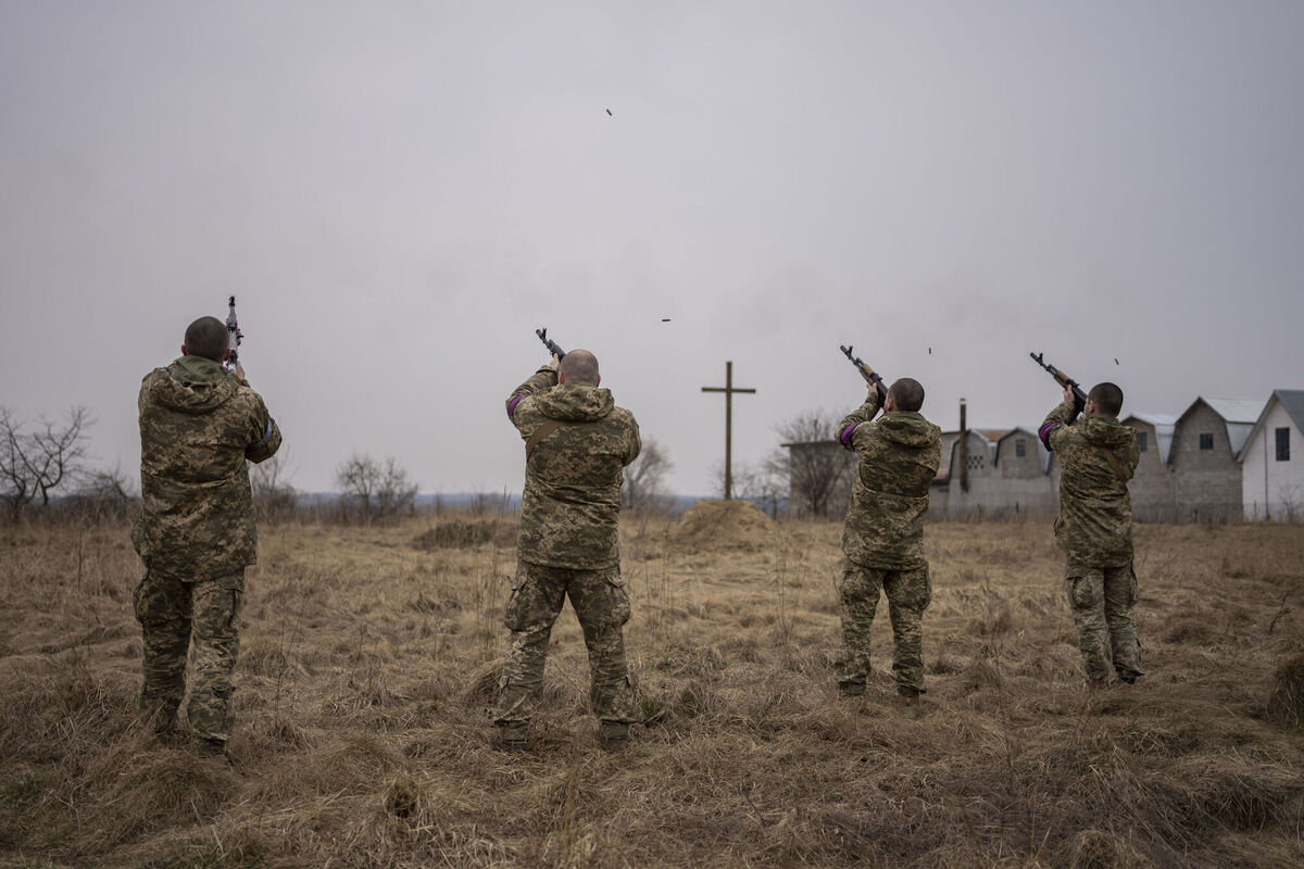 Ukrainian military servicemen fire salutes during the funeral of their comrades, Roman Rak and Mykola Mykytiuk, in Starychi, western Ukraine, Wednesday, March 16, 2022. Rak and Mykytiu were killed during Sunday's Russian missile strike on a military training base in Yavoriv. Picture: AP Photo/Bernat Armangue Ukrainian military servicemen fire salutes during the funeral of their comrades, Roman Rak and Mykola Mykytiuk, in Starychi, western Ukraine, Wednesday, March 16, 2022. Rak and Mykytiu were killed during Sunday's Russian missile strike on a military training base in Yavoriv. Picture: AP Photo/Bernat Armangue