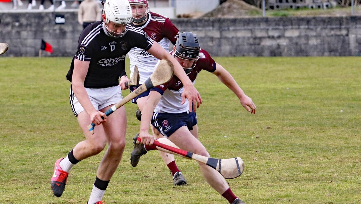BURST: Mikey O'Connell, St Francis College Rochestown, clashing with Darragh Morrissey, Colaiste Bhaile Chlair, in the All Ireland Senior B Hurling Championship final in Meelick.