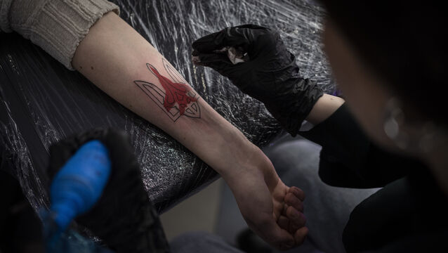 Ukrainian Natalia Tanchynets works on a patriotic-themed tattoo at her workshop in Lviv, Western Ukraine (Bernat Armangue/AP) Ukrainian Natalia Tanchynets works on a patriotic-themed tattoo at her workshop in Lviv, Western Ukraine (Bernat Armangue/AP)