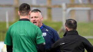 <p>Waterford selector Peter Leahy with referee Chris Maguire after their defeat to Sligo at Fraher Field  Picture: Eddie O'Hare</p>