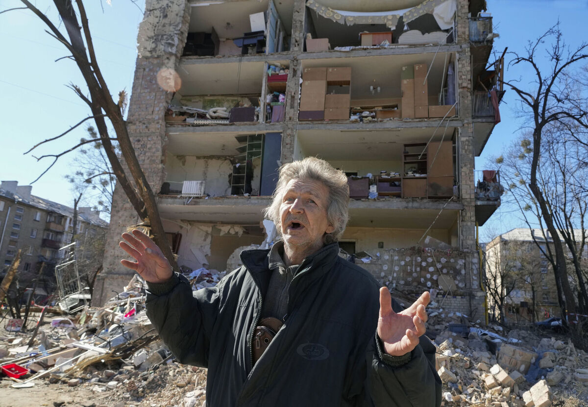 A man stands near his ruined house after Russian shelling in Kyiv on Monday.  Photo: AP Photo/Efrem Lukatsky