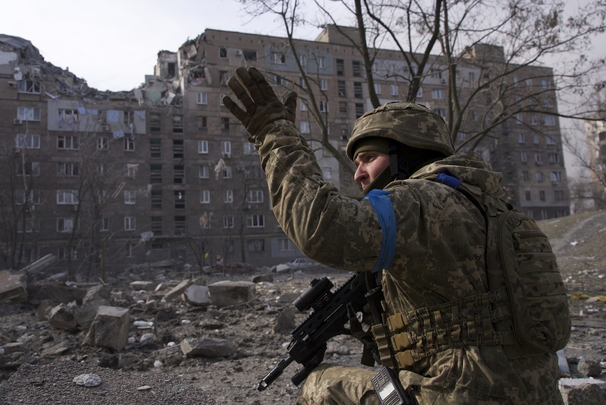Ukraine retakes key Kyiv suburb as fleeing Mariupol civilians describe corpses in the streets