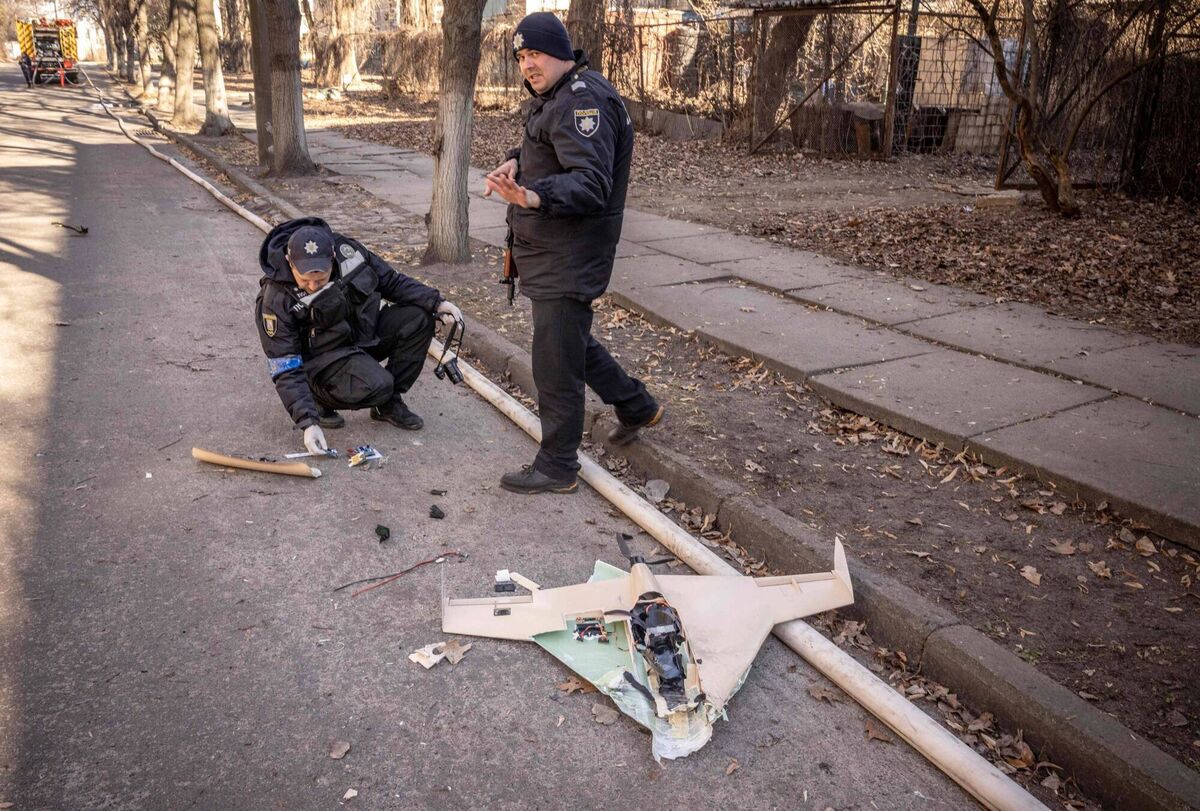 Ukrainian police officers inspect a downed Russian drone in the area of a research institute, part of Ukraine's National Academy of Science, after a strike, in northwestern Kyiv, on March 22, 2022. Picture: FADEL SENNA/AFP via Getty Images
