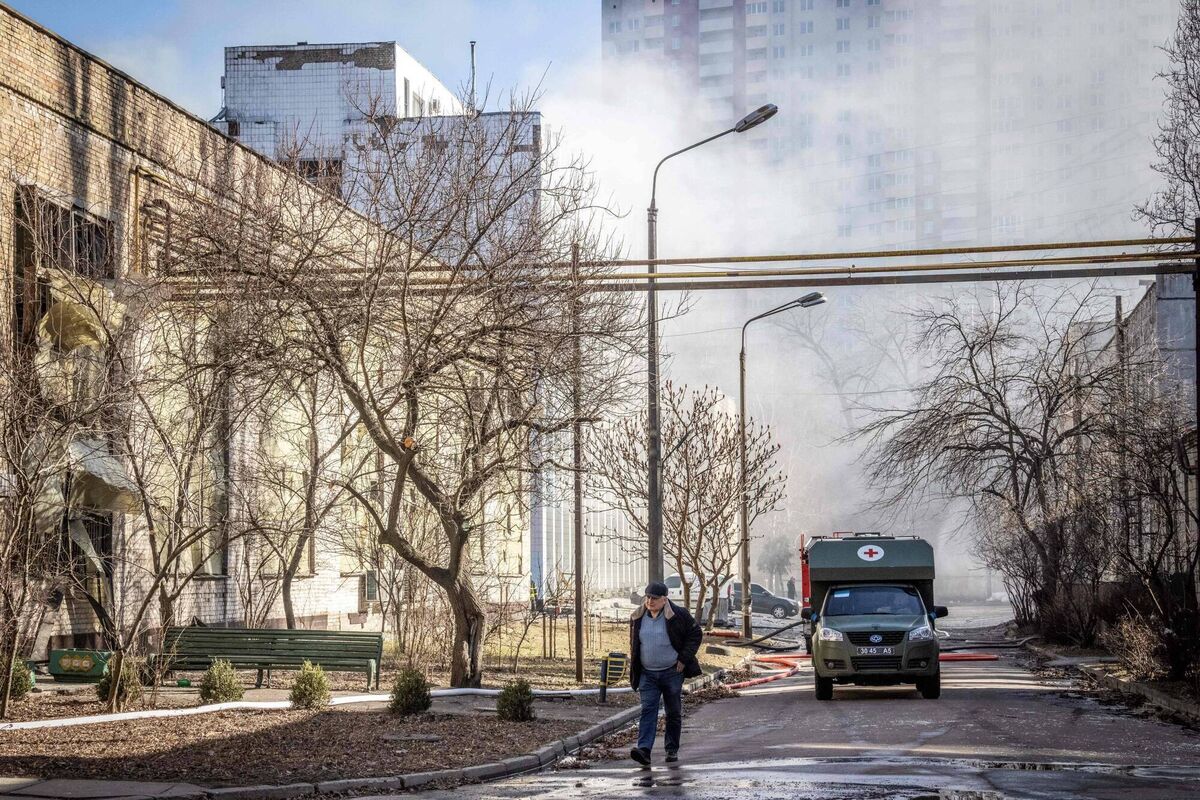 A man walks in the street after a Russian drone hit a building of the Institute for Superhard Materials, part of Ukraine's National Academy of Science, in Kyiv, on March 22, 2022. Picture: FADEL SENNA/AFP via Getty Images