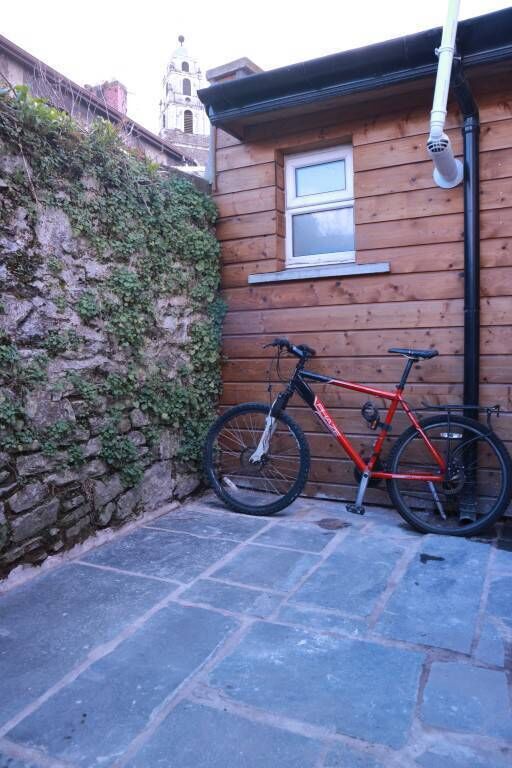 Old flagstones at the back of 4 Courtneys Avenue with Shandon Steeple views above