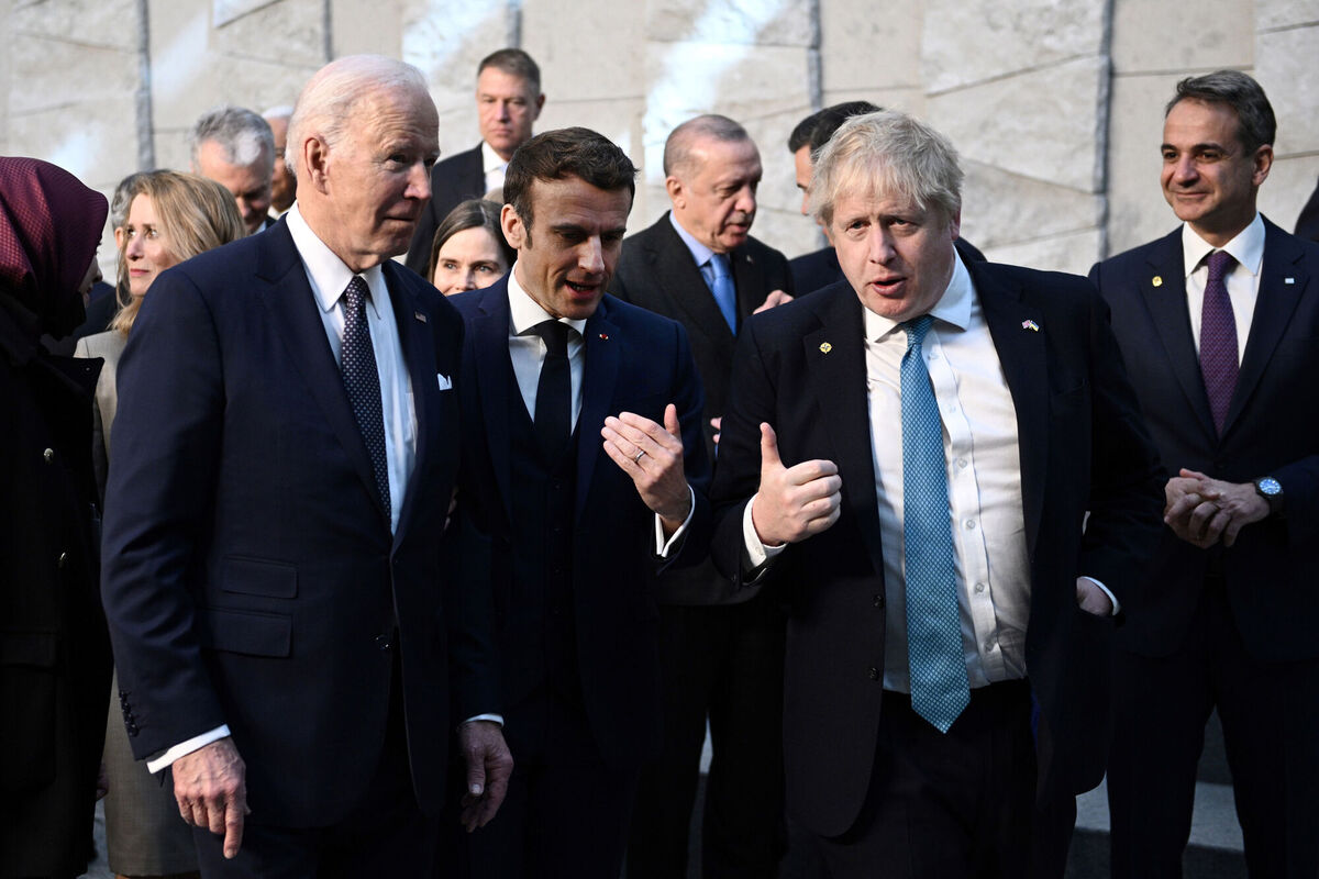 President Joe Biden, left, talks with French President Emmanuel Macron and British Prime Minister Boris Johnson, right, as they arrive at NATO Headquarters in Brussels, Thursday, March 24, 2022. Picture: Brendan Smialowski, Pool via AP