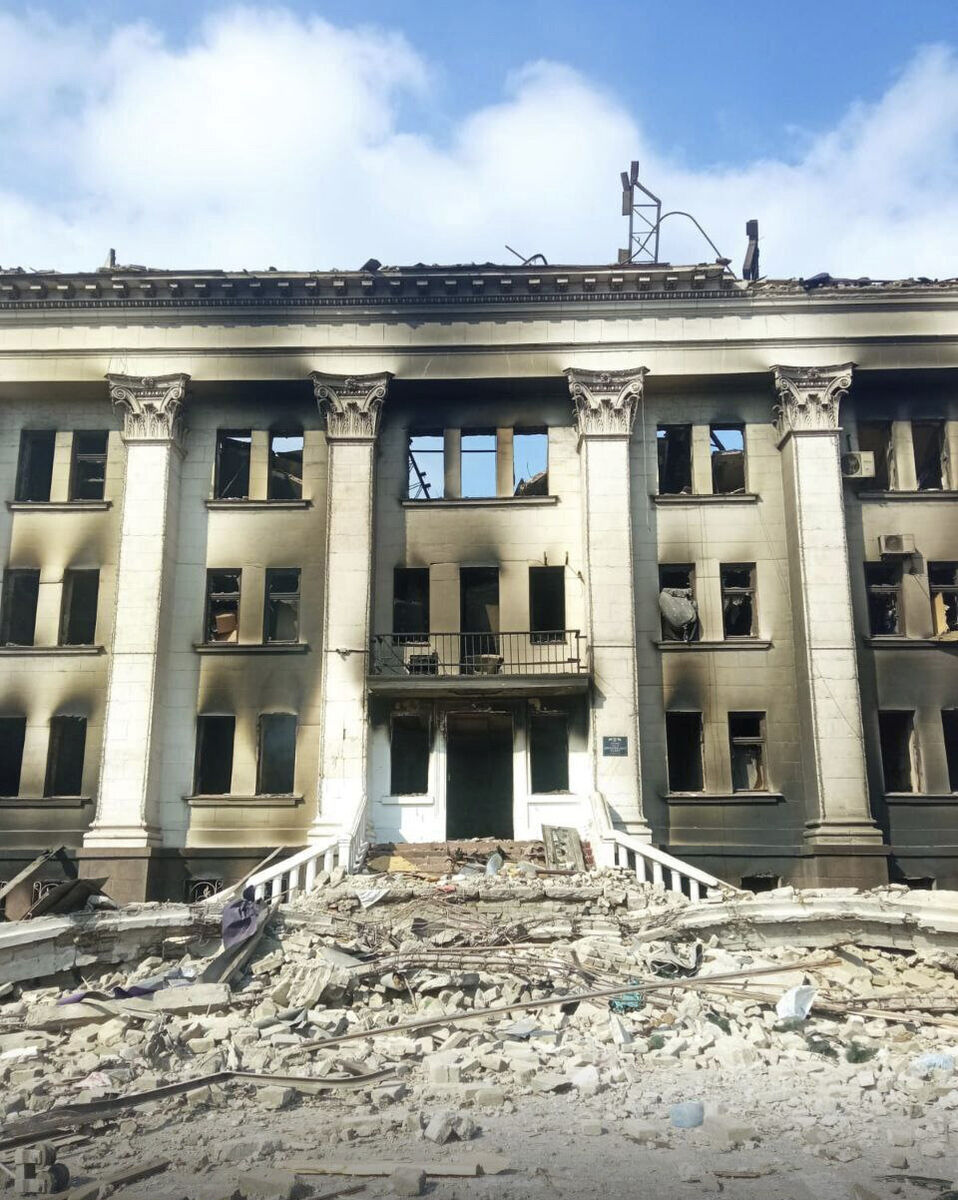 This image made available by Azov Battalion, shows the drama theater, damaged after shelling, in Mariupol, Ukraine, Thursday March 17, 2022.  (Azov Battalion via AP)