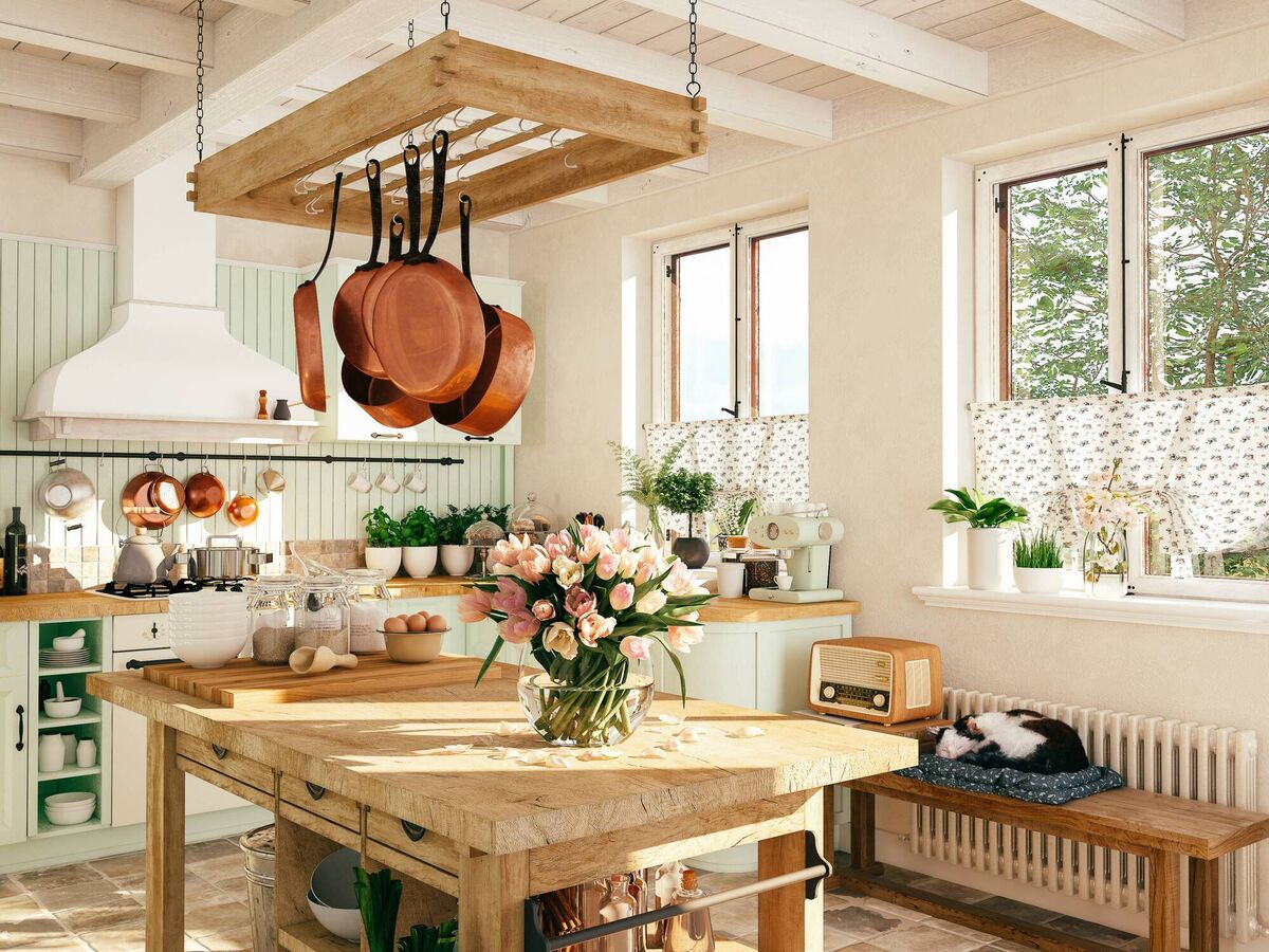  The colour of these copper pans is a stunning aesthetic element in this well loved country kitchen. Picture: iStock