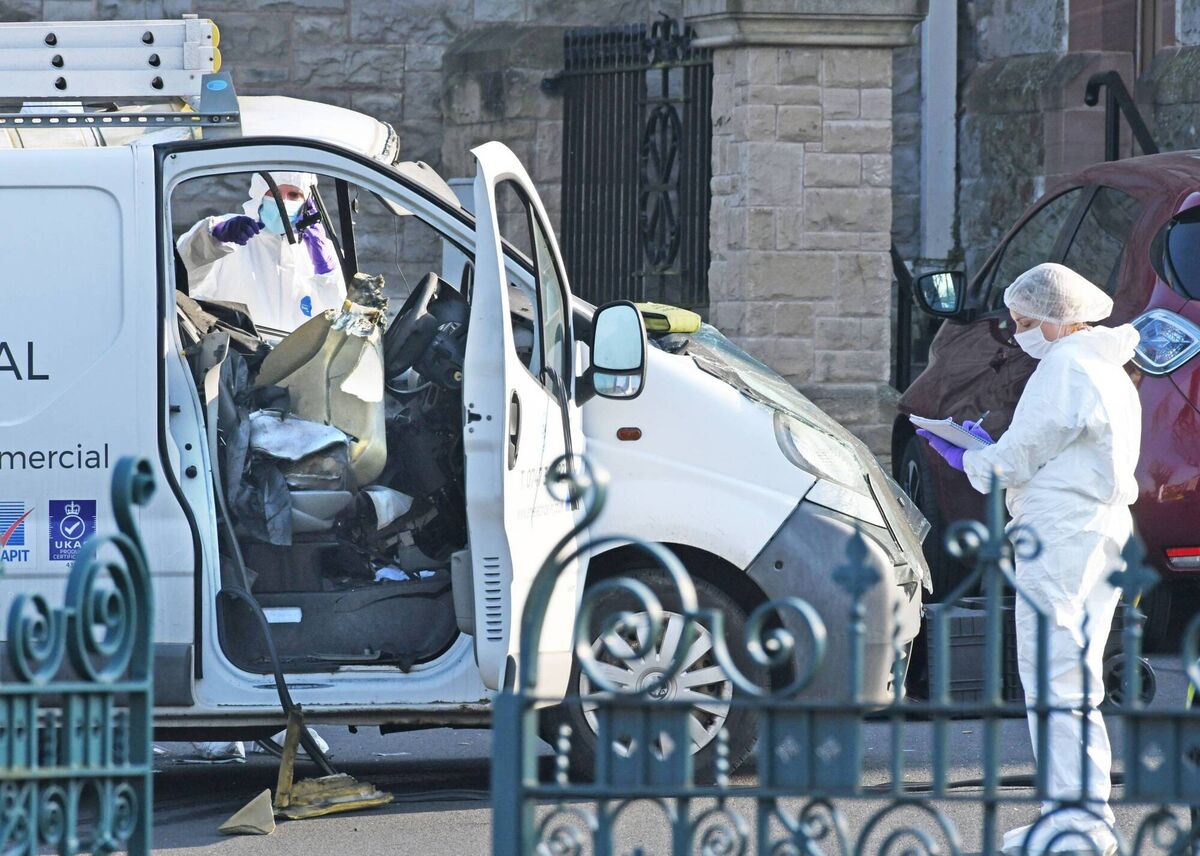 Following two controlled explosions, police forensics officers examine a hi-jacked van that was left outside a community hall where Minister for Foreign Affairs Simon Coveney was taking part in a speaking engagement. Photo: Alan Lewis - PhotopressBelfast.co.uk