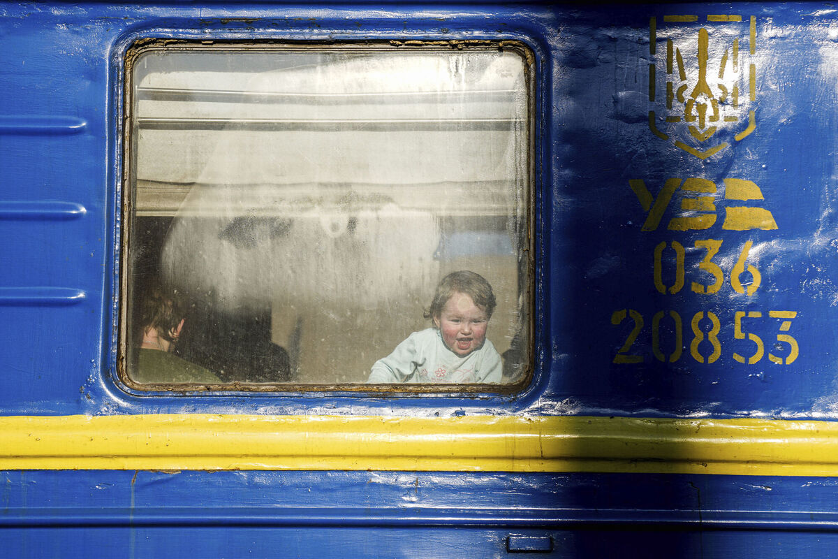 A toddler from Mariupol looks out from a train window before departing to Lviv from the train station of Zaporizhia, Ukraine, Monday, March 21, 2022. (AP Photo/Evgeniy Maloletka) A toddler from Mariupol looks out from a train window before departing to Lviv from the train station of Zaporizhia, Ukraine, Monday, March 21, 2022. (AP Photo/Evgeniy Maloletka)