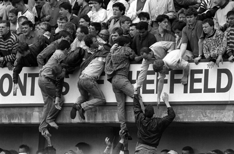 Liverpool fans trying to escape danger at Hillsborough football stadium in Sheffield in 1989. The pain endured by the city of Liverpool in the wake of the stadium disaster, in which 97 people were killed, was acutely felt by many in Ireland. Picture: David Giles/PA Liverpool fans trying to escape danger at Hillsborough football stadium in Sheffield in 1989. The pain endured by the city of Liverpool in the wake of the stadium disaster, in which 97 people were killed, was acutely felt by many in Ireland. Picture: David Giles/PA