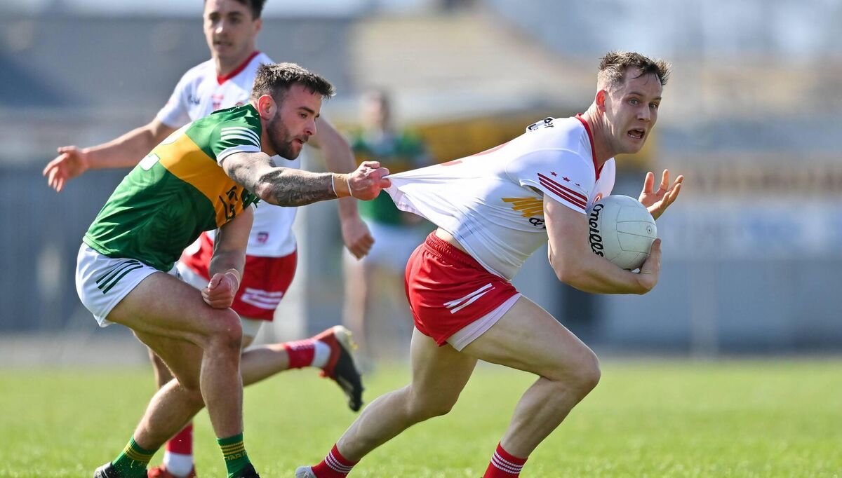 BREAKING FREE: Kieran McGeary of Tyrone is tackled by Micheál Burns of Kerry at Fitzgerald Stadium in Killarney. Pic: Brendan Moran, Sportsfile