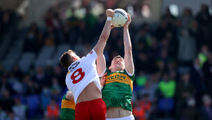<p>Tyrone’s Conn Kilpatrick and Diarmuid O'Connor of Kerry in action in Fitzgerald Stadium on Sunday.</p>