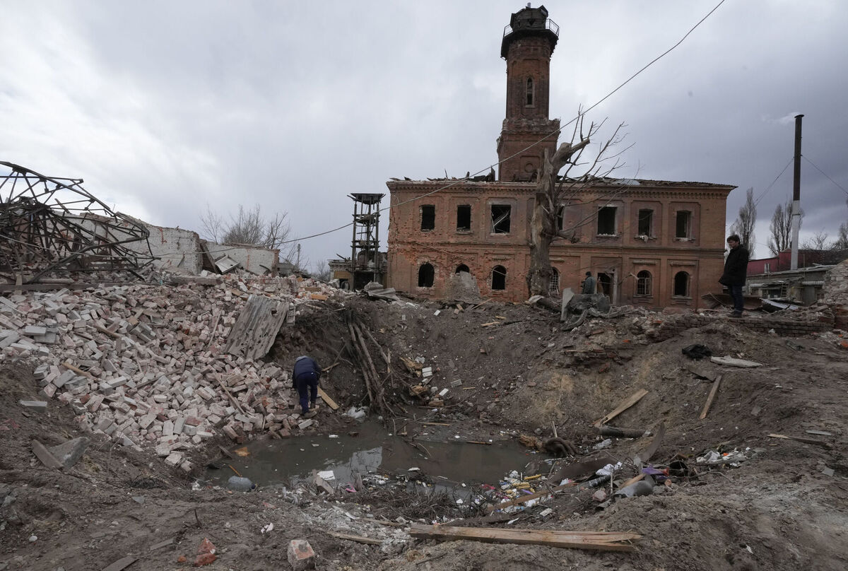 A man inspects a crater of a rocket launched by the Russian forces at night in the center of Kharkiv, Ukraine, Sunday, March 27, 2022. Picture: AP Photo/Efrem Lukatsky A man inspects a crater of a rocket launched by the Russian forces at night in the center of Kharkiv, Ukraine, Sunday, March 27, 2022. Picture: AP Photo/Efrem Lukatsky