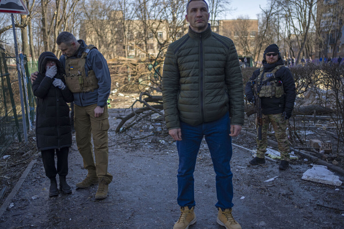 Ukrainian former heavyweight boxing world champion Wladimir Klitschko, center, looks on as his brother Kyiv Mayor, Vitali Klitschko, left, comforts a neighbor who cries at the site where a bombing damaged residential buildings in Kyiv, Ukraine, Friday, March 18, 2022. Picture: AP Photo/Rodrigo Abd Ukrainian former heavyweight boxing world champion Wladimir Klitschko, center, looks on as his brother Kyiv Mayor, Vitali Klitschko, left, comforts a neighbor who cries at the site where a bombing damaged residential buildings in Kyiv, Ukraine, Friday, March 18, 2022. Picture: AP Photo/Rodrigo Abd