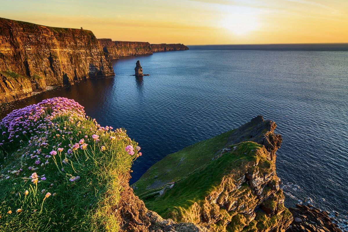 Epic sunset at the Cliffs of Moher in County Clare, Ireland, located along the Wild Atlantic Way. Epic sunset at the Cliffs of Moher in County Clare, Ireland, located along the Wild Atlantic Way.