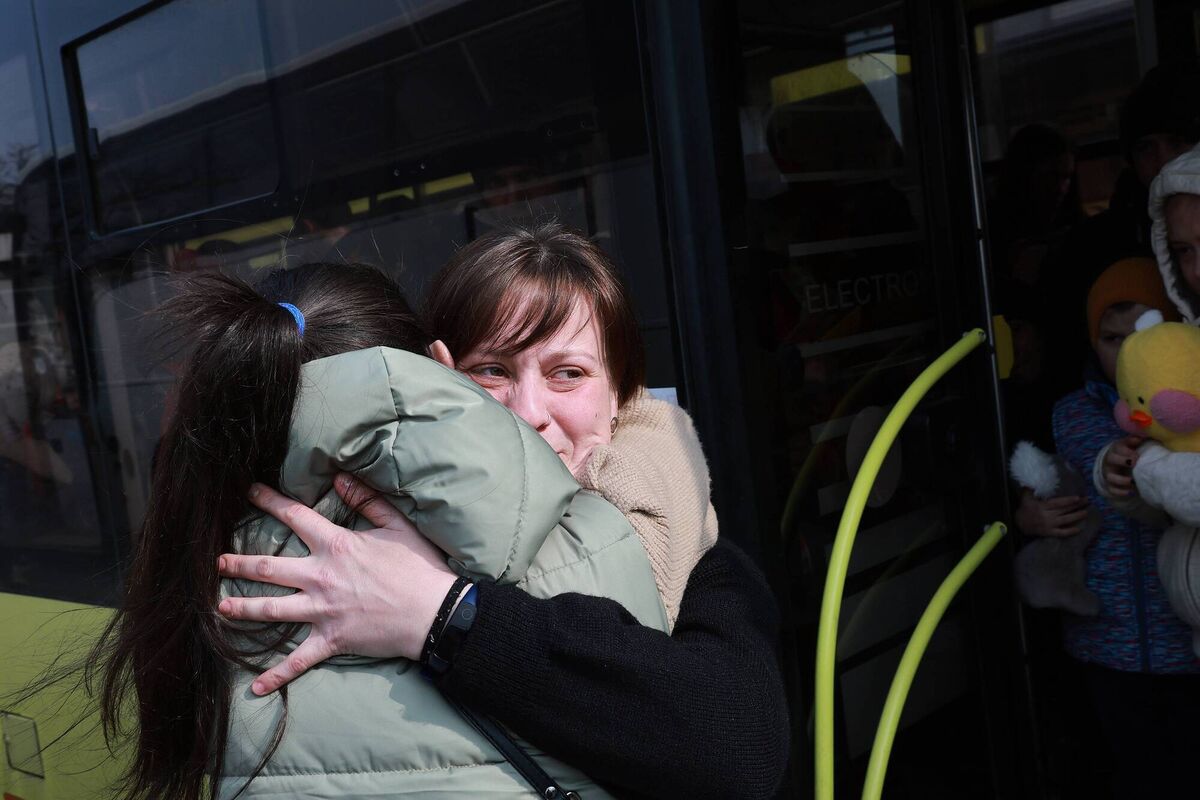 Inna Lazareva hugs her sister Alina Koval goodbye before boarding a bus to Poland from the main train station in Lviv, Ukraine. Picture: Photo by Joe Raedle/Getty Images