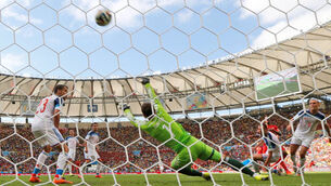 Late first goal puts Belgium into next round