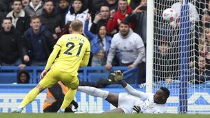 <p>Brentford's Christian Eriksen scores his side's second goal during the English Premier League soccer match between Chelsea and Brentford, at the Stamford Bridge stadium in London, Saturday, April 2, 2022. (AP Photo/Ian Walton)</p>
