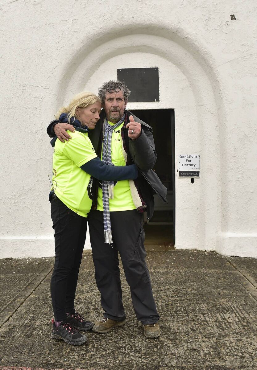 Charlie and his wife Claire took a moment together after completing the tough climb. Picture: Conor McKeown Charlie and his wife Claire took a moment together after completing the tough climb. Picture: Conor McKeown