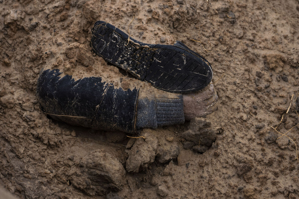 The hand of a corpse emerges from a mass grave in Bucha, on the outskirts of Kyiv, Ukraine, Sunday, April 3, 2022. Picture: AP Photo/Rodrigo Abd The hand of a corpse emerges from a mass grave in Bucha, on the outskirts of Kyiv, Ukraine, Sunday, April 3, 2022. Picture: AP Photo/Rodrigo Abd