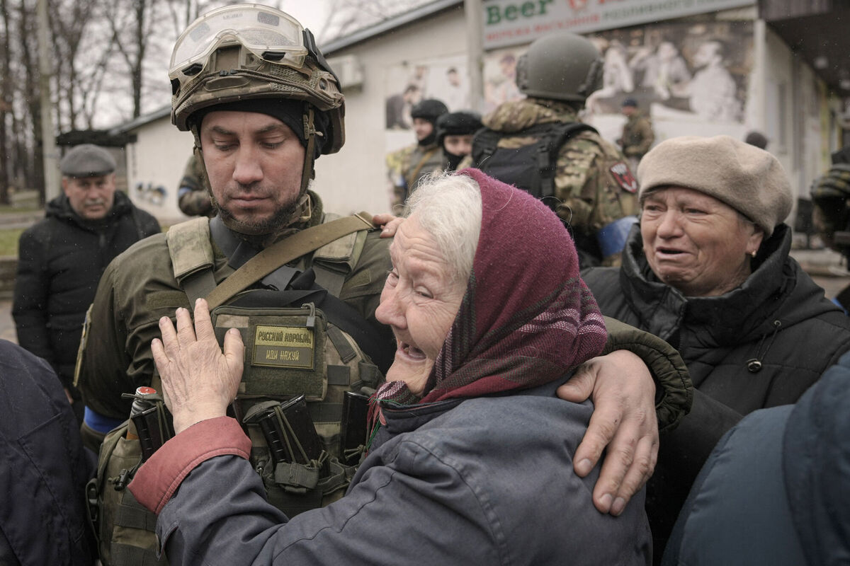 A woman hugs a Ukrainian serviceman after a convoy of military and aid vehicles arrived in the formerly Russian-occupied Kyiv suburb of Bucha, Ukraine, Saturday, April 2, 2022.Picture: AP Photo/Vadim Ghirda A woman hugs a Ukrainian serviceman after a convoy of military and aid vehicles arrived in the formerly Russian-occupied Kyiv suburb of Bucha, Ukraine, Saturday, April 2, 2022.Picture: AP Photo/Vadim Ghirda