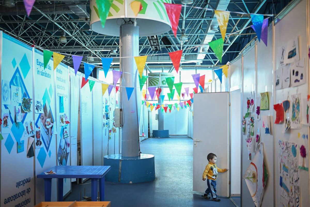 A Ukrainian refugee child walks into an improvised playground at the "Moldexpo" exhibition centre. Photo: Daniel Mihailescu / AFP via Getty Images