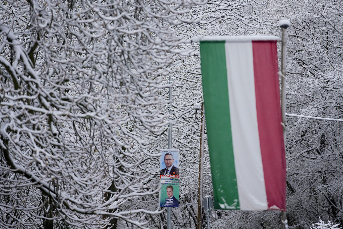 Elections posters and the Hungarian flag outside a polling station in Budapest on Sunday. Hungary’s political system is now closer to that of non-EU Serbia, which this weekend saw a simultaneous victory for another nationalist electoral authoritarian, President Aleksandar Vučić, than it is to that of a democracy such as France or Portugal. Photo: AP/Petr David Josek