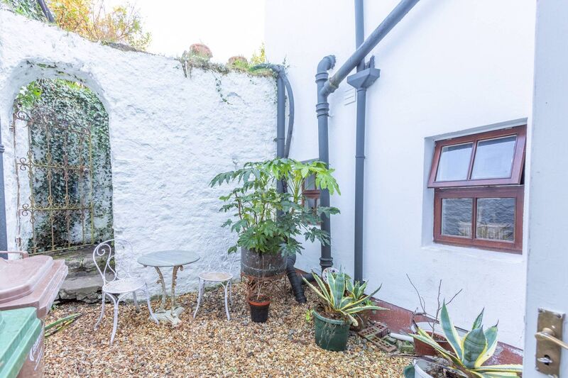 Courtyard links No 2 to a rear garden further beyond