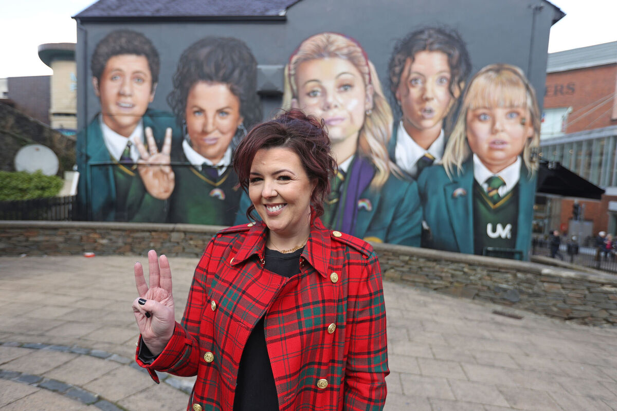 Writer Lisa McGee in front of a Derry Girls mural in Dublin, ahead of the premiere for the third series of Channel 4's Derry Girls at the Omniplex Cinema in Derry. Picture: Liam McBurney/PA Wire