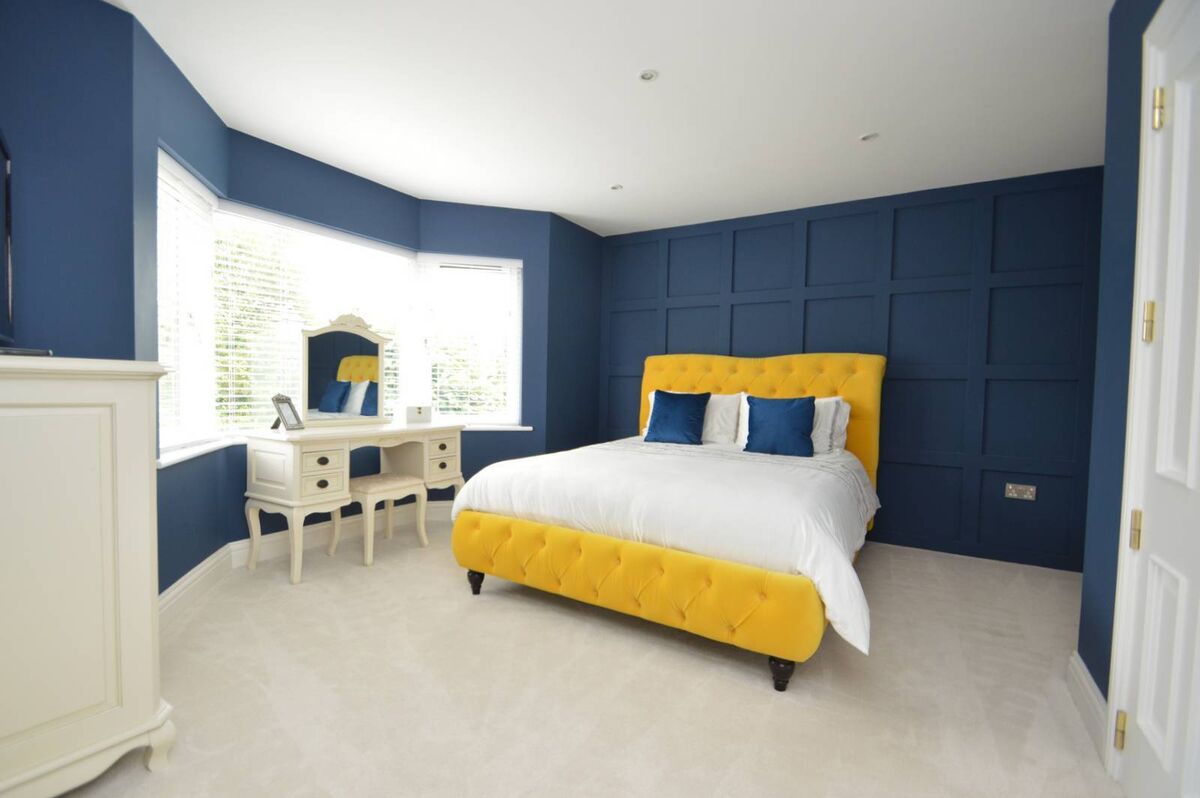 Main bedroom with feature panelled wall Main bedroom with feature panelled wall