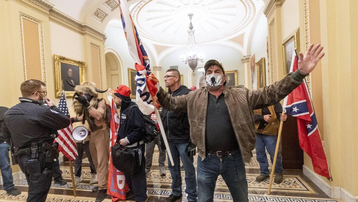 Supporters of Donald Trump are confronted by US Capitol Police outside the Senate Chamber during the notorious invasion of the US Capitol on January. 6, 2021. Picture: Manuel Balce Ceneta/AP